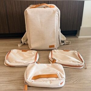 Nordace 15" Backpack with 2 packing cubes and 1 cosmetic case.